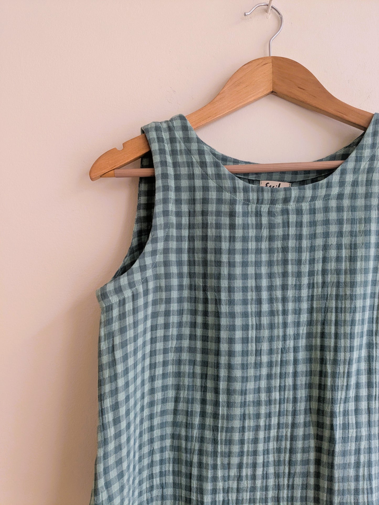 Women's sleeveless cotton top in green checks - closeup image