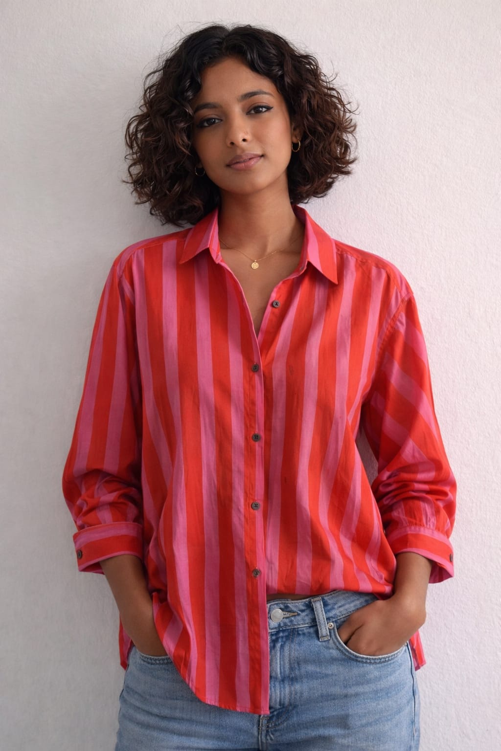 Women's cotton oversized shirt in red and pink stripes, full sleeves - full model image