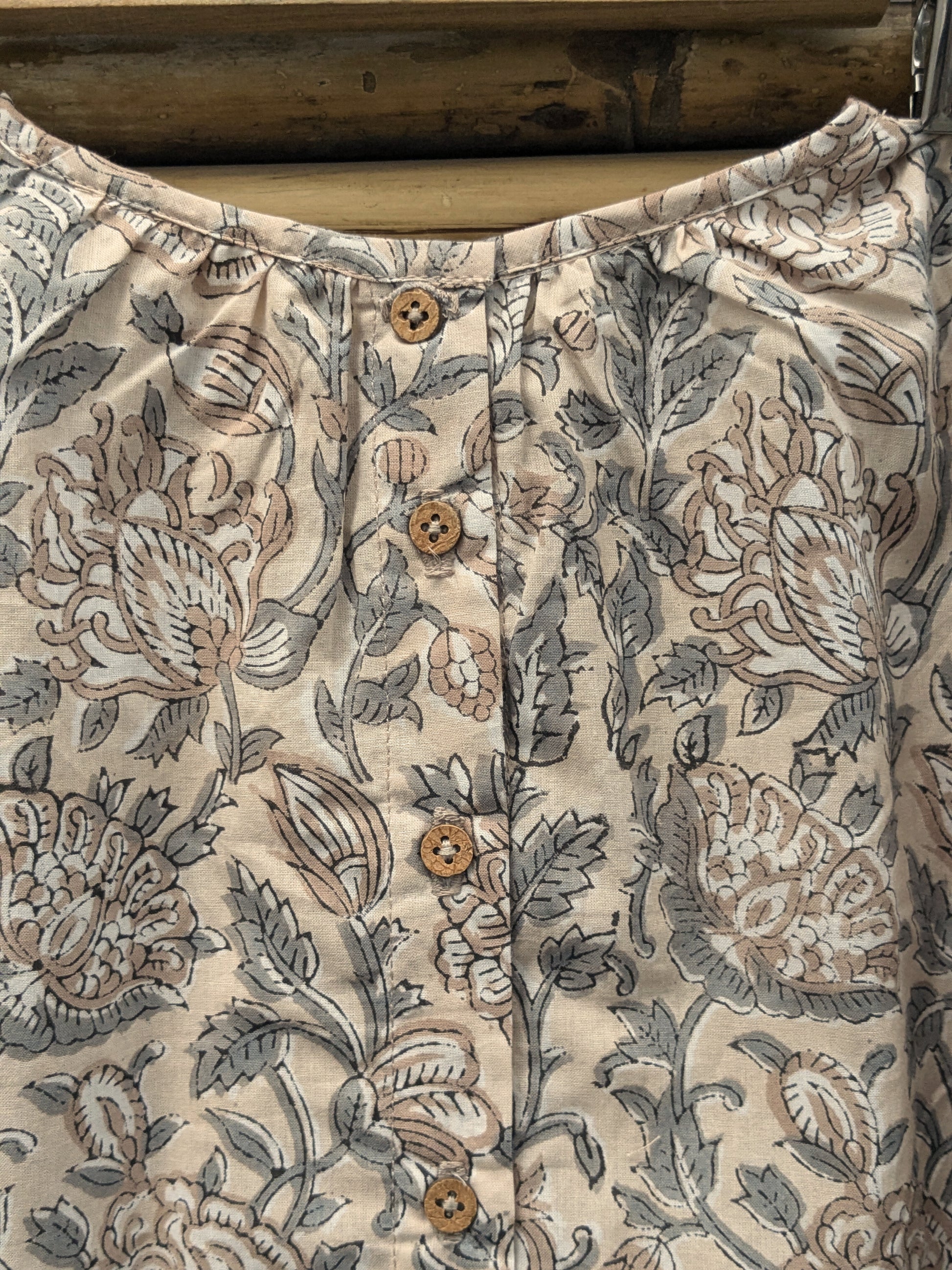 Girls sleeveless dress in brown and grey - closeup image