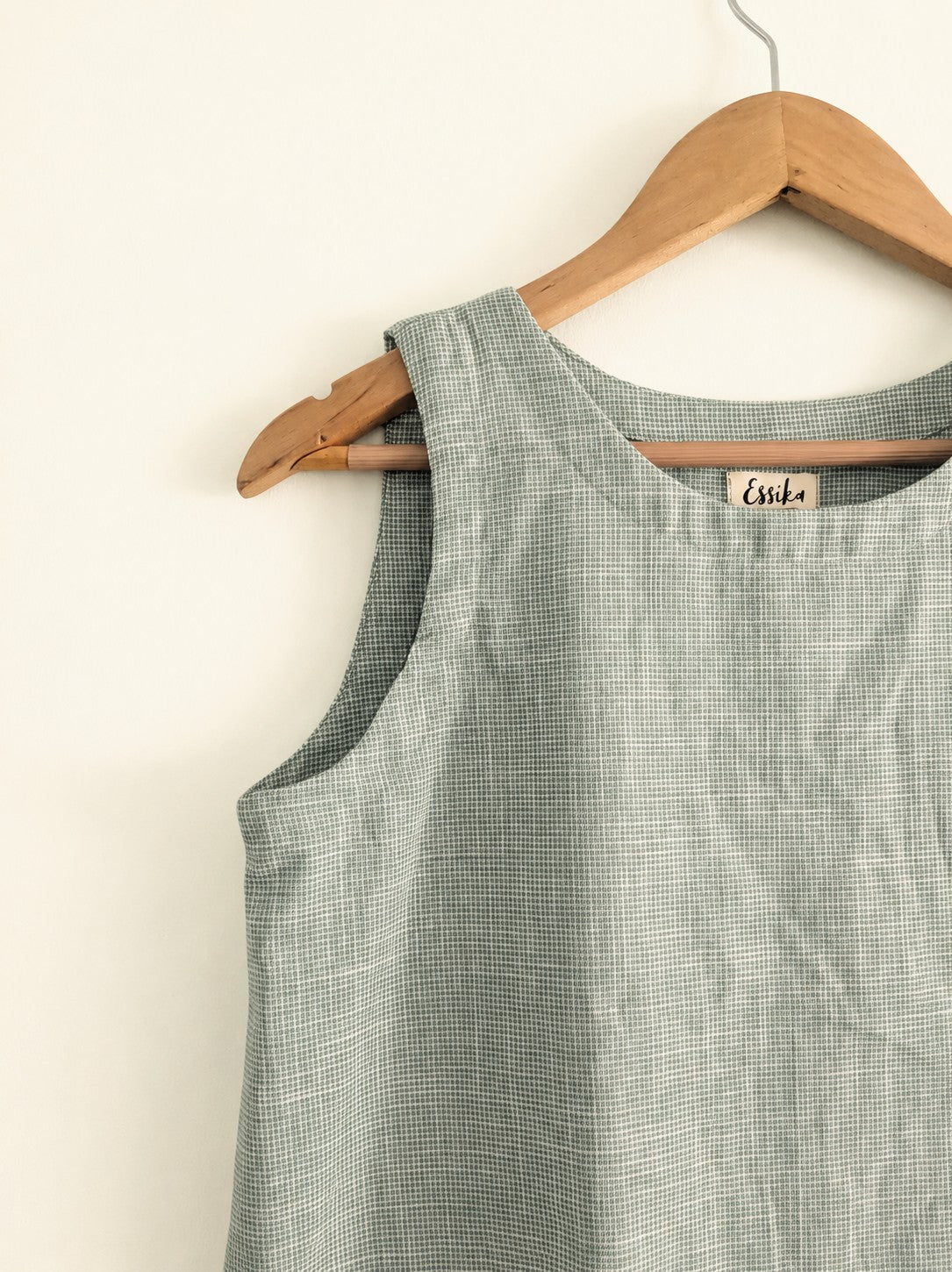 Women's sleeveless top made with cotton linen in green - closeup image