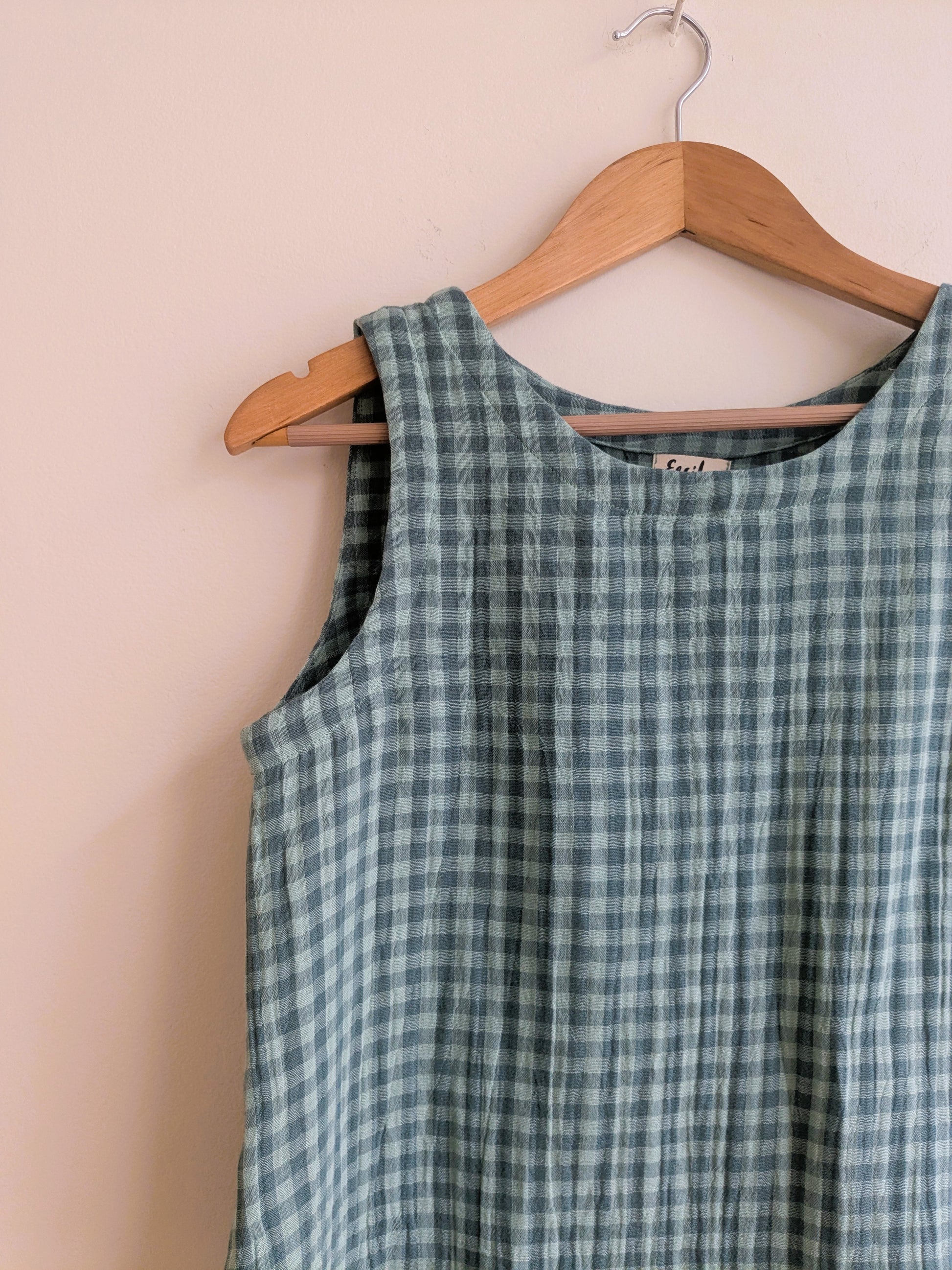 Women's sleeveless cotton top in green checks - closeup image