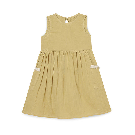Girls Tie back dress | Lemon gauze | 2 yrs to 6 yrs An easy-fitting sleeveless dress for girls in a simple, classic style. Features a roomy bodice, gathered knee-length skirt and two large pockets to hold knick-knacks. The back is secured with fabric ties. Hand or machine wash with a gentle detergent 
