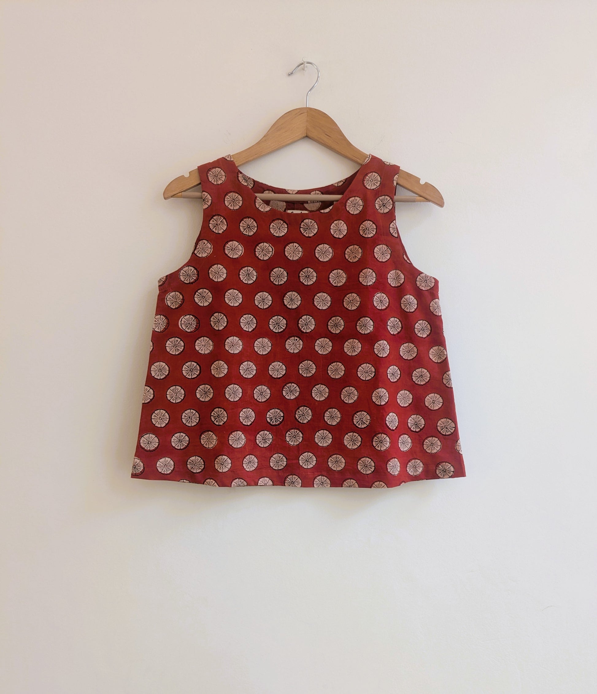 Women's sleeveless top in brick red - front image