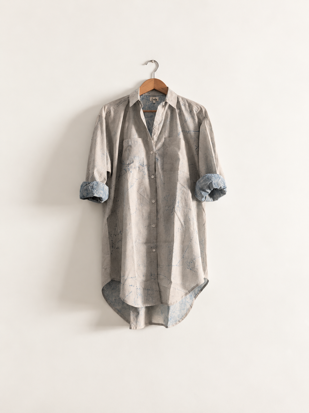 Women's shirt dress in cotton block print with full sleeves and collar in white and blue - front image
