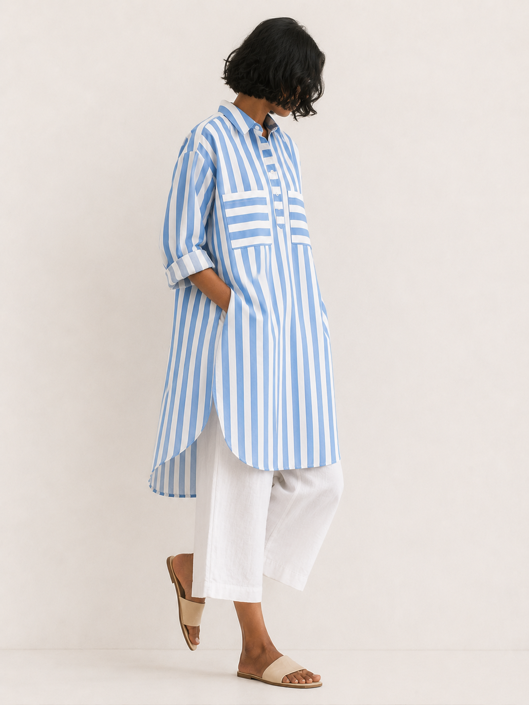 Women’s cotton oversized kurta in white and blue with full sleeves, cuffs, and a collar -Model image