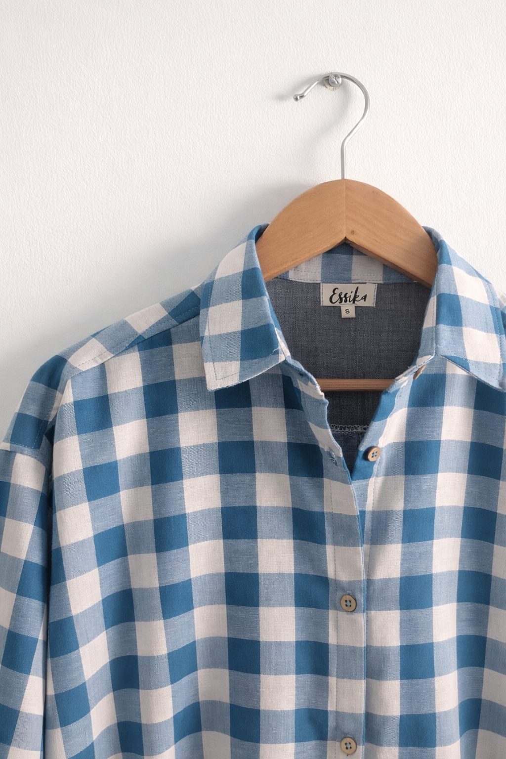 Women’s oversized shirt in blue & white check cotton double cloth with collar neck and cuffed sleeves – front close-up image