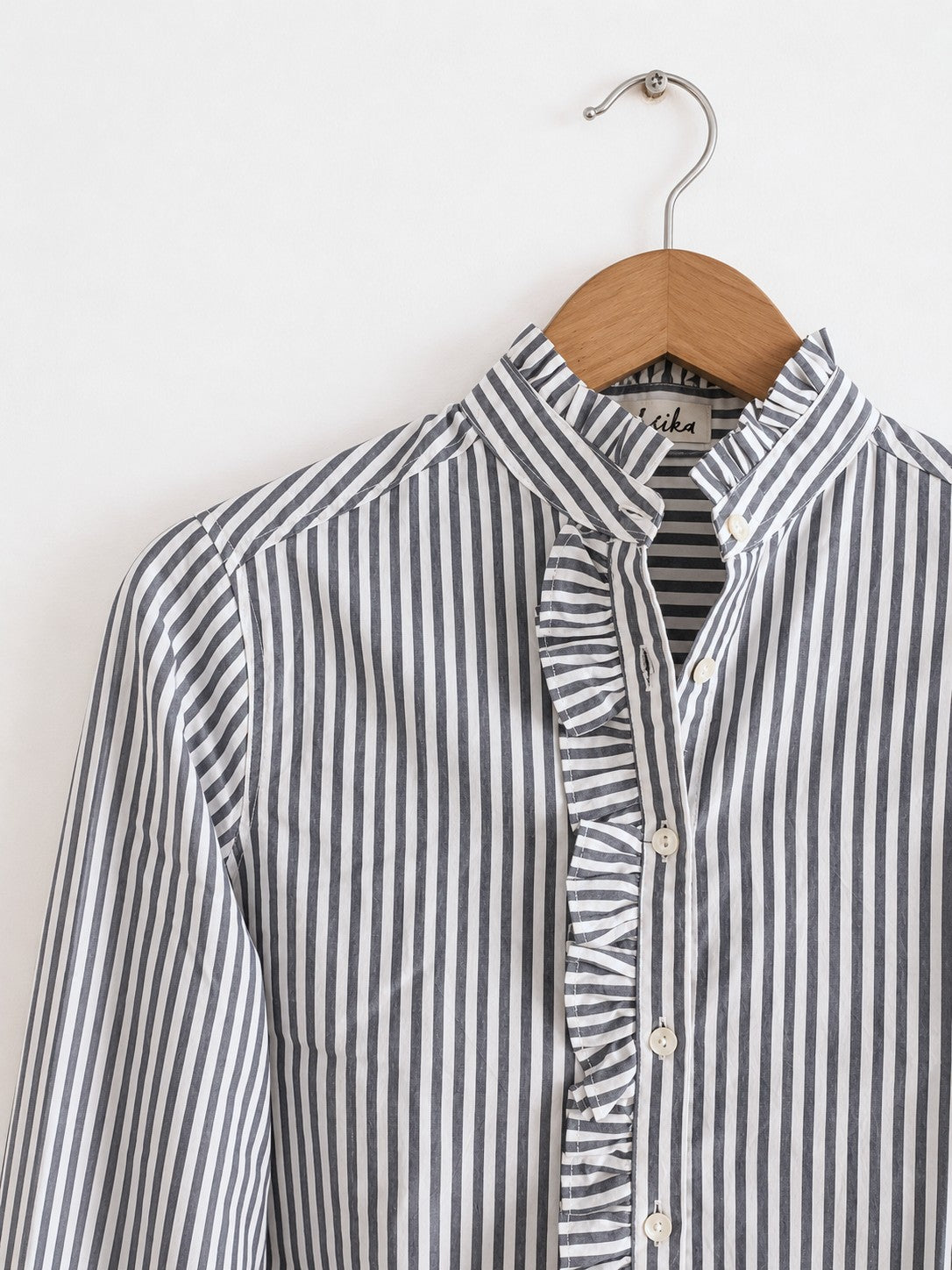 Women's regular full sleeves shirt  with ruffles, made with cotton in black and white stripes - closeup image