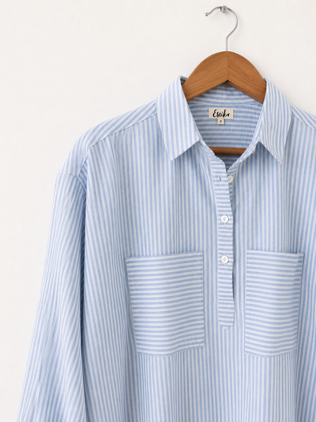 Women's oversized cotton kurta in light blue and white stripes with full sleeves, cuff and collar - close up image